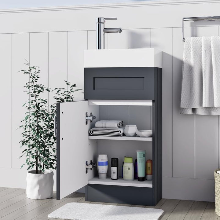 Light grey 400mm vanity unit with open cabinet door showing internal storage shelves and towels